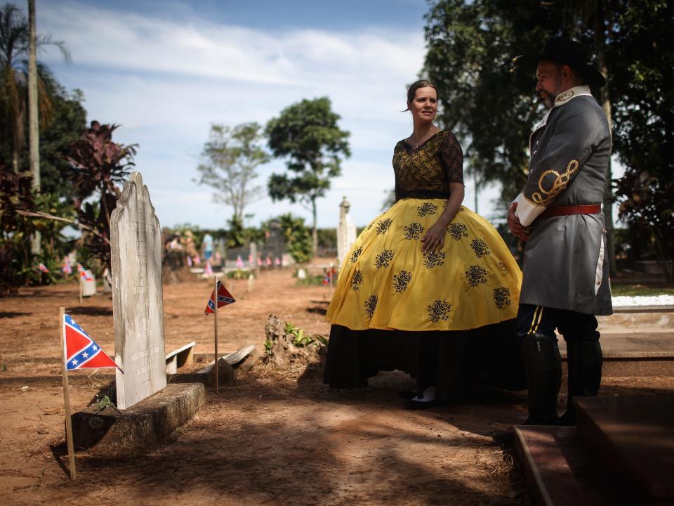 people visit grave at confederate fstival