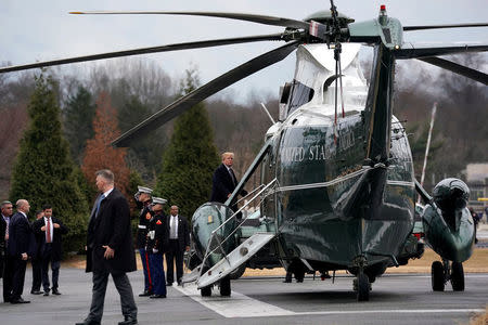 U.S. President Donald Trump boards the Marine One helicopter upon his departure after his annual physical exam at Walter Reed National Military Medical Center in Bethesda, Maryland, U.S., January 12, 2018. REUTERS/Yuri Gripas