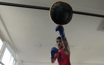 A member of the Afghan national boxing team trains during a session in local gym in Serbia, Wednesday, Dec. 1, 2021. They practiced in secrecy and sneaked out of Afghanistan to be able to compete at an international championship. Now, the Afghan boxing team are seeking refuge in the West to be able to continue both their careers and lives without danger or fear. (AP Photo/Darko Vojinovic)