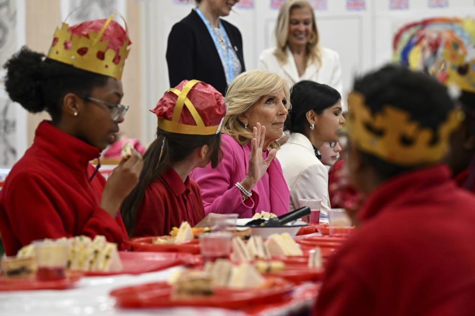 US First Lady Jill Biden reacts as she meets pupils during a visit at the Charles Dickens Primary School, in London, Friday May 5, 2023. (Oli Scarff/Pool Photo via AP)