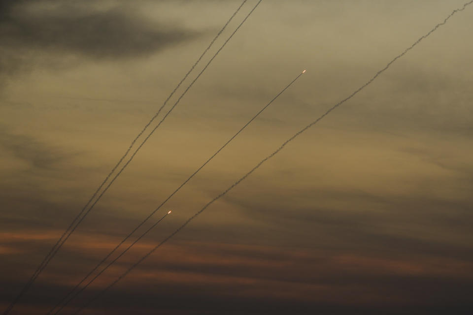 Rockets are fired toward Israel from the Gaza Strip, as seen from southern Israel, Thursday, Oct. 26, 2023. (AP Photo/Francisco Seco)