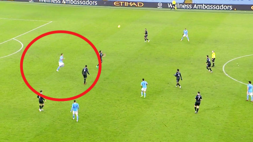 Man City player Rodri (pictured left) offside but running back to make a tackle.