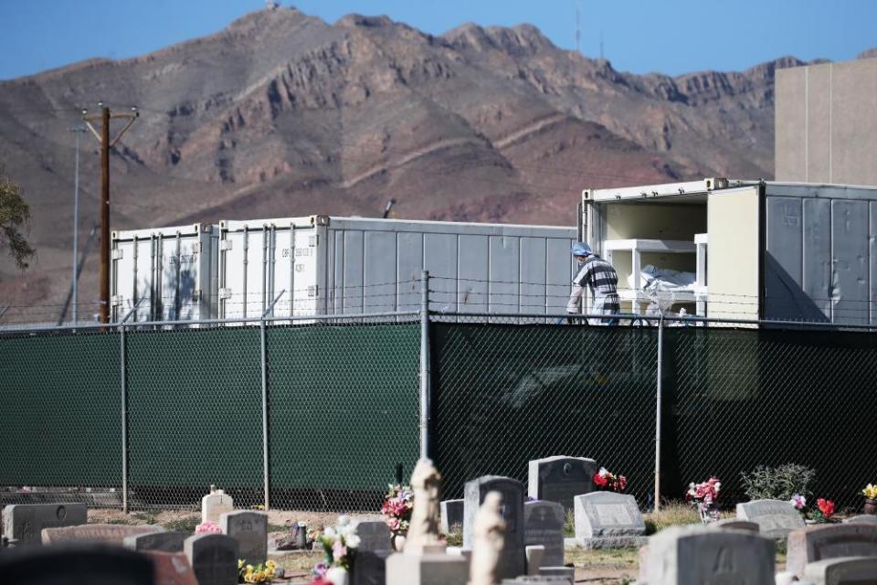 Inmates from the El Paso county detention facility prepare to load bodies into a refrigerated temporary morgue on 16 November.