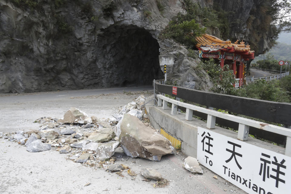 Rocks are on the road at the entrance of Taroko National Park in Hualien County, eastern Taiwan, Thursday, April 4, 2024. The strongest earthquake in a quarter-century has rocked Taiwan during the morning rush hour. (AP Photo/Chiang Ying-ying)