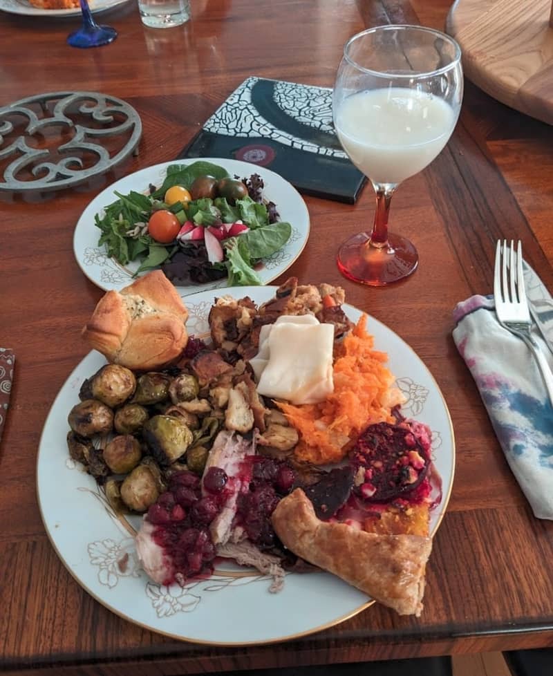 mashed sweet potato, brussel sprouts, cranberry sauce, glass of milk, small side salad