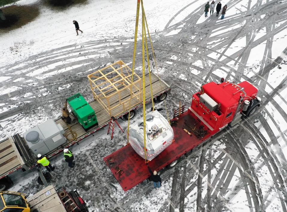 A huge crane lifts an MRI scanner machine into Shields MRI in Brockton on Wednesday, Jan. 24, 2024.