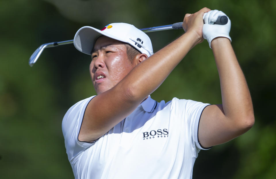 Byeong Hun An follows a shot on the ninth hole during the second round of the Wyndham Championship golf tournament at Sedgefield Country Club in Greensboro, N.C., Friday, Aug. 2, 2019. (H. Scott Hoffmann/News & Record via AP)