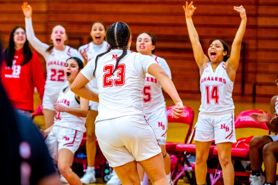 New Bedford's Zaria Anderson is fired up along with her teammates as the build on the lead over Brockton.