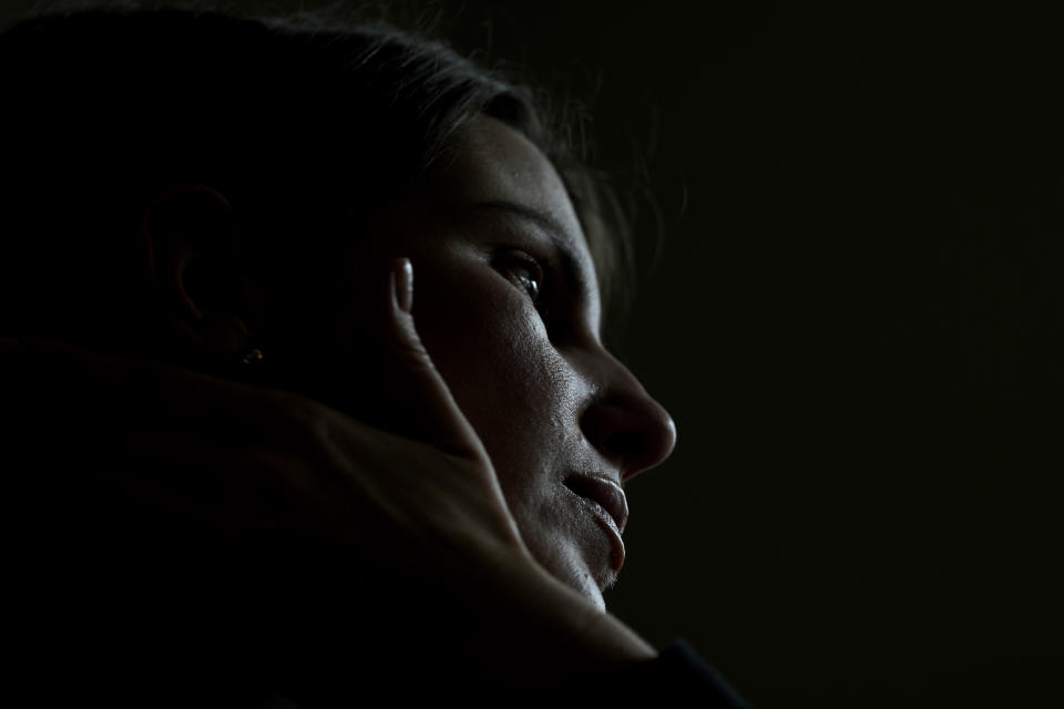 Viktoria Kovalenko reacts as she speaks to The Associated Press during an interview at her home in a village in Kent, Thursday, Feb. 9, 2023. Kovalenko chose to come to England not only because it offered her refuge from the war in Ukraine. It was also a chance for her to escape from her harrowing memories of losing her family in a shell attack. (AP Photo/Frank Augstein)