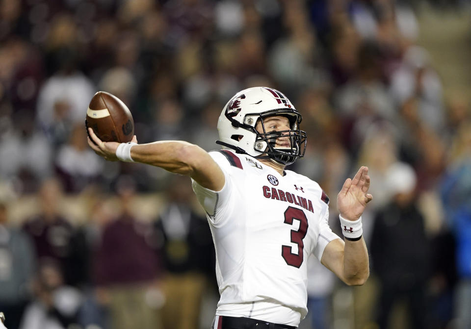 FILE - South Carolina quarterback Ryan Hilinski (3) throws a pass against Texas A&M during the first quarter of an NCAA college football game Saturday, Nov. 16, 2019, in College Station, Texas. South Carolina and coach Will Muschamp haven't had a true quarterback competition since 2016 _ and he's taking much of the way through camp as Ryan Hilinski, Collin Hill and Luke Doty try to become the Gamecocks' passer. (AP Photo/David J. Phillip, File)