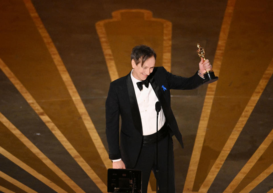 German composer Volker Bertelmann accepts the Best Score award for All Quiet on the Western Front during the Academy Awards on March 12.