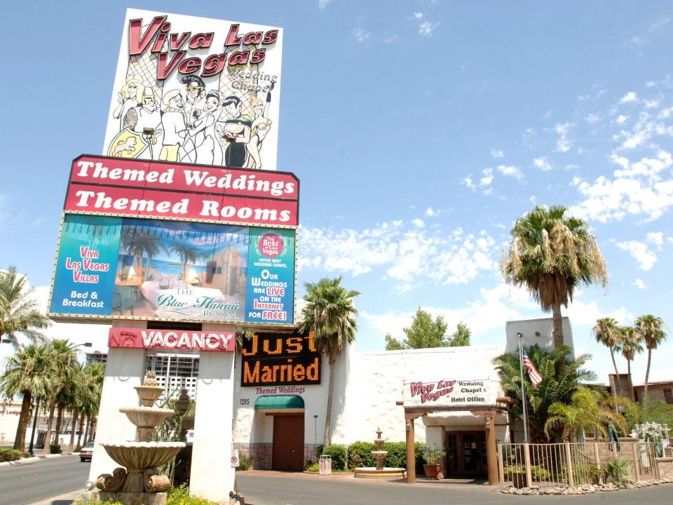 The Viva Las Vegas wedding chapel with a blue sky behind it.