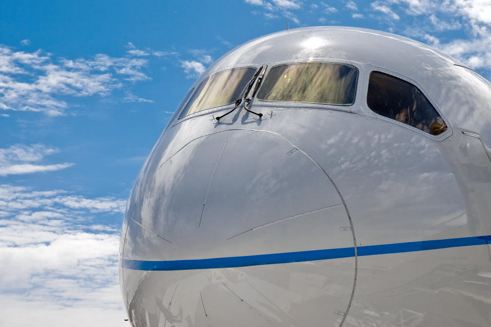 Close up of the nose of a Boeing 787 Dreamliner commercial jet airliner