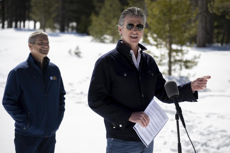 Gov. Gavin Newsom announces the new California Water Plan with California Natural Resources Secretary Wade Crowfoot during the April snow survey at Phillips Station in El Dorado County on Tuesday, April 2, 2024. (Paul Kitagaki Jr./The Sacramento Bee via AP, Pool)