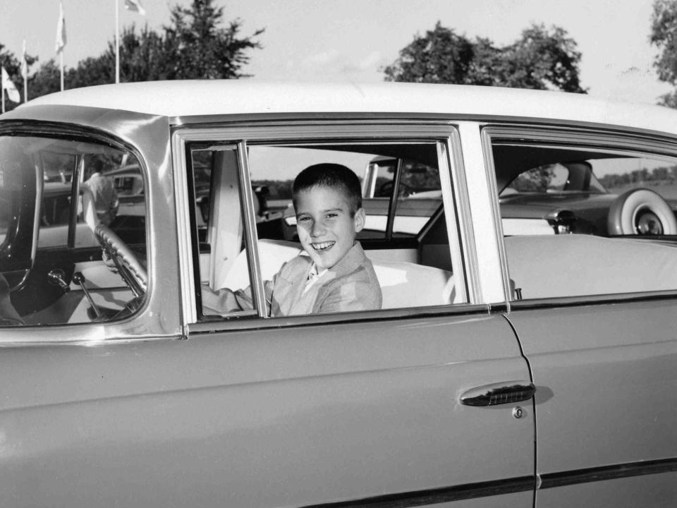 Mitt Romney in an archive family photo in a Nash automobile, 1957.