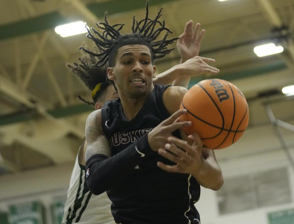 Feb 23, 2022; Phoenix, AZ, USA;  Hamilton guard Quincy Adams (1) grabs a rebound against Sunnyslope guard Marcus Heatherly (13) during the 6A boys quarterfinal at Sunnyslope HS gym.