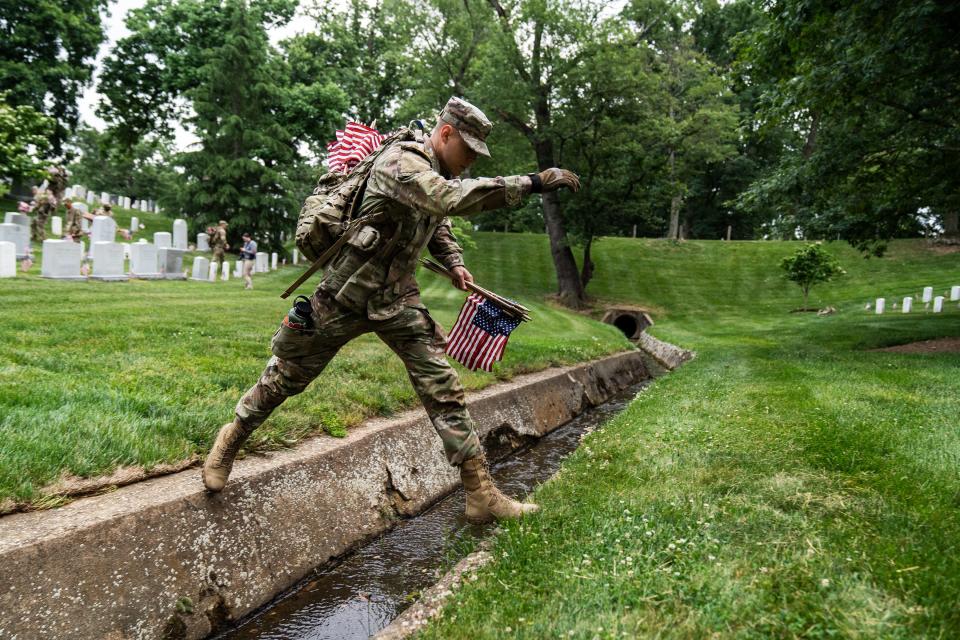 A member of the 3rd U.S. Infantry Regiment also known as “The Old Guard” take part in a joint service “Flags-In” ceremony at Arlington National Cemetery on Thursday, May 25, 2023.