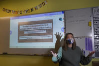 Susannah Remillard speaks in her sixth-grade classroom at Cape Cod Lighthouse Charter School, Thursday, Nov. 19, 2020, in East Harwich, Mass. In a growing number of U.S. schools, students are now learning a more complex Thanksgiving story that involves conflict, injustice and a new focus on the native people who lived in New England for hundreds of years before European settlers arrived. (AP Photo/Elise Amendola)