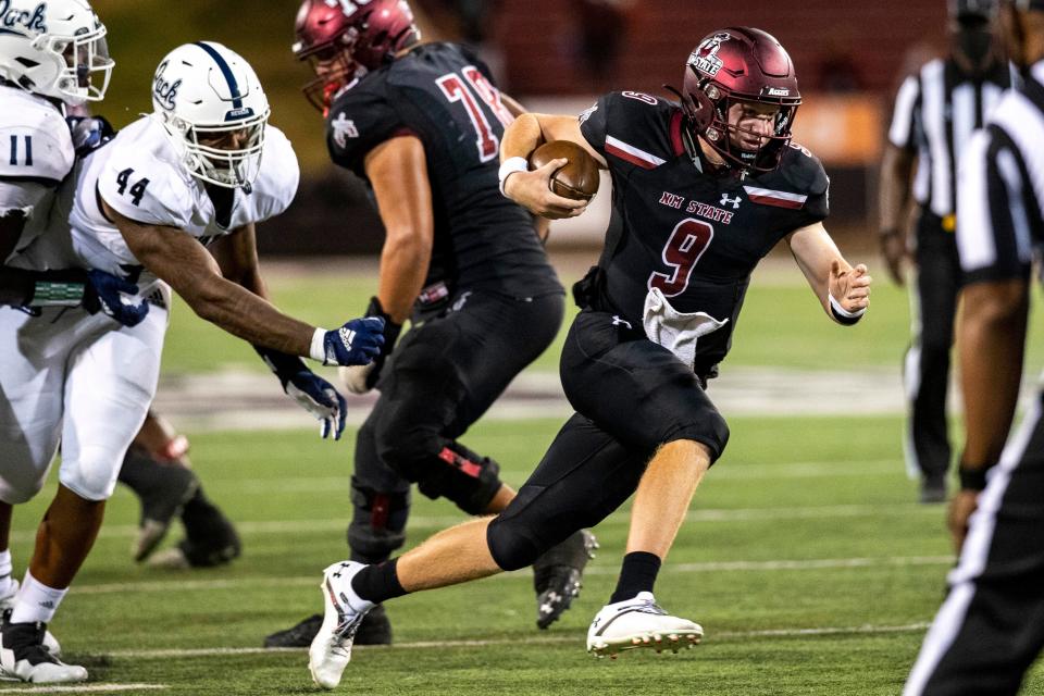 NMSU quarterback Gavin Frakes runs the ball during the New Mexico State University game on Saturday, Aug. 27, 2022, at the Aggie Memorial Stadium. 