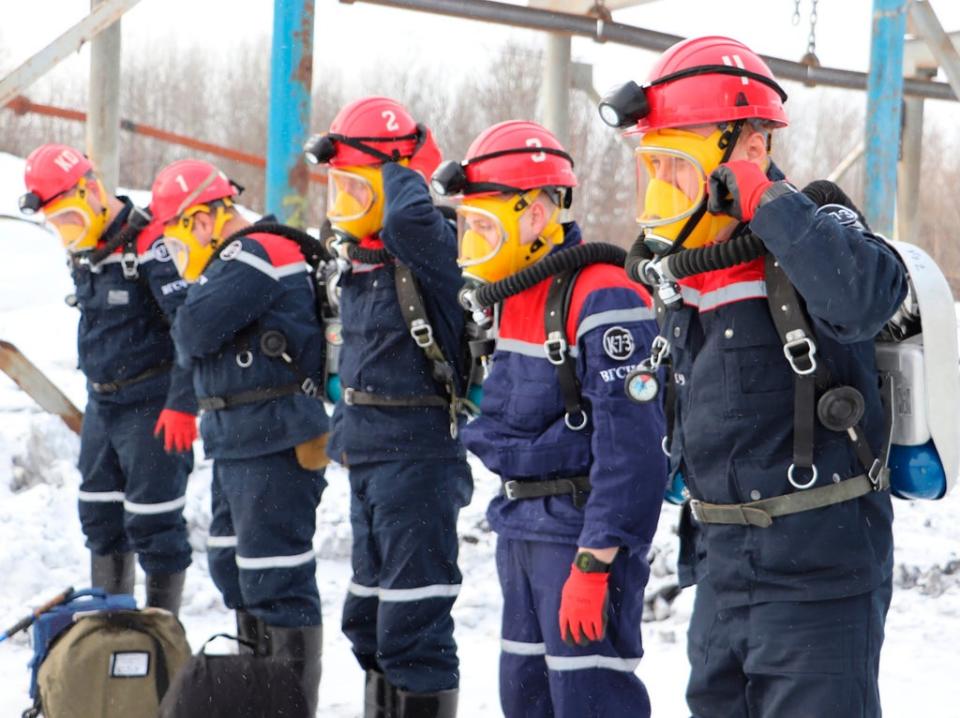 Rescuers prepare to work at a fire scene at a coal mine (AP)