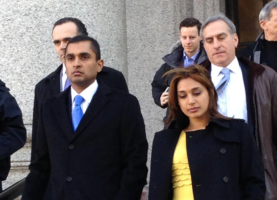 Mathew Martoma, left, leaves federal court in New York City with his wife, Rosemary, Thursday, Feb. 6, 2014, after being convicted of helping his company earn more than a quarter billion dollars illegally through trades based on secrets about the testing of a potential breakthrough Alzheimer's drug. The verdict capped a three-week trial that featured testimony from two prominent doctors who confessed spilling secrets to Mathew Martoma during lucrative consultations with financiers. (AP Photo/Larry Neumeister)