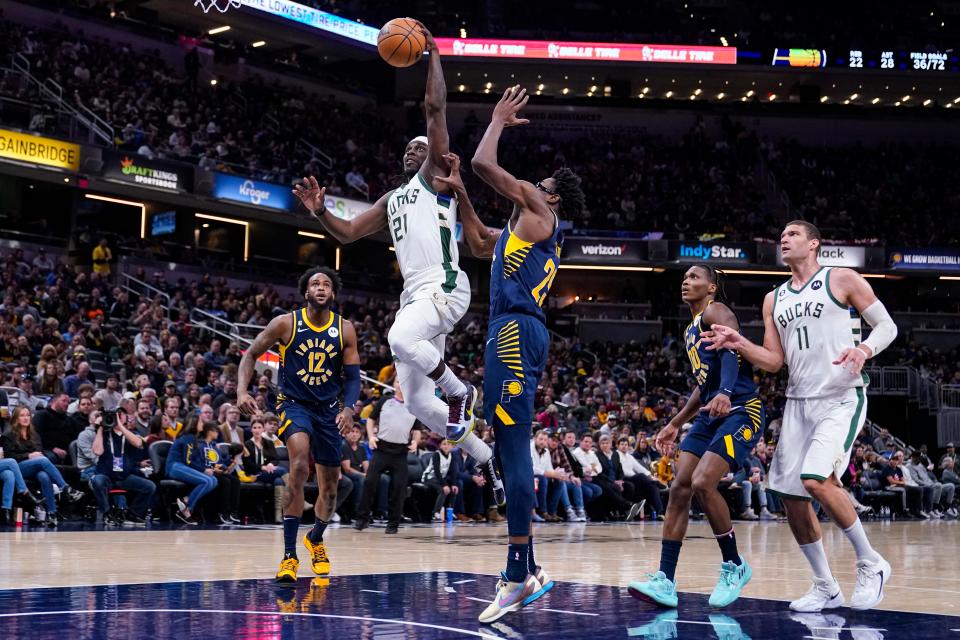 Bucks guard Jrue Holiday goes past Pacers forward Jalen Smith for two of his career-high 51 points during the second  half Wednesday night.