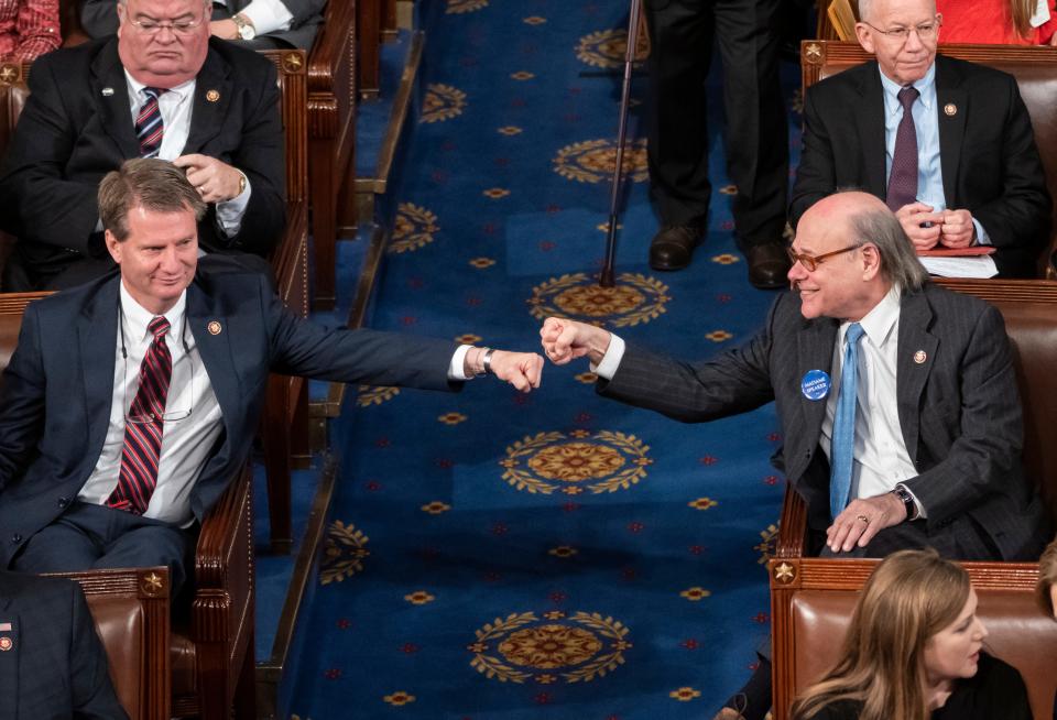 Newly-elected Rep. Tim Burchett, a Tennessee Republican, left, and Rep. Steve Cohen, a Tennessee Democrat, exchange a fist bump from opposite sides of the aisle on the first day of the 116th Congress as the Democrats take the majority from the GOP, at the Capitol in Washington, Thursday, Jan. 3, 2019.