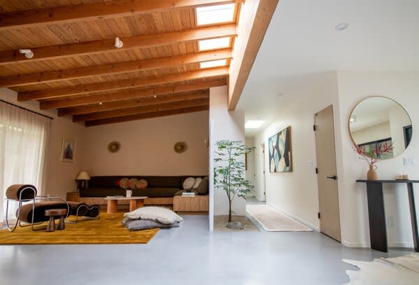 A row of skylights stretches across the main living area, ushering ample sunshine inside.