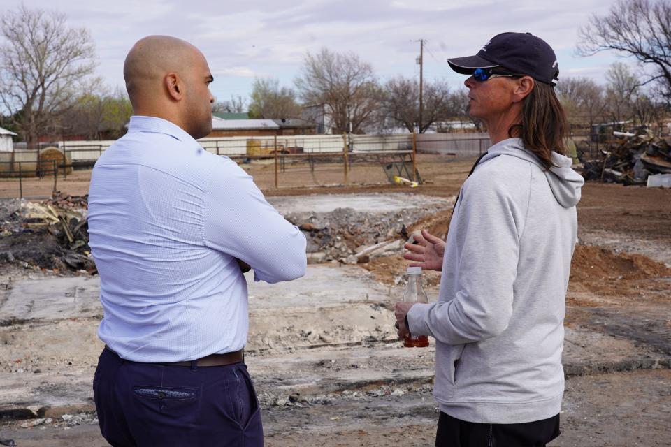 U.S. Rep Colin Allred speaks last Sunday with a person whose home was destroyed by recent wildfires in Fritch.