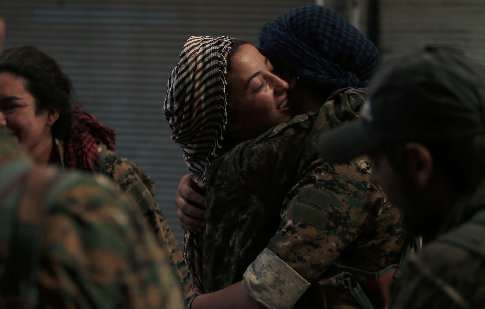 <p>Syria Democratic Forces (SDF) female fighters embrace each other in the city of Manbij, in Aleppo Governorate, Syria, Aug. 10, 2016. (REUTERS/Rodi Said) </p>