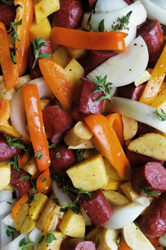 <p>Reluctant Entertainer</p><p>A lovely parsnips rutabaga sausage sheet pan dinner filled with vegetables, our favorite beef sausage, olive oil and fresh herbs.</p><p><strong>Get the recipe: <a href="https://reluctantentertainer.com/parsnips-rutabaga-sausage-sheet-pan-dinner/" rel="nofollow noopener" target="_blank" data-ylk="slk:Parsnips Rutabaga Sausage Sheet Pan Dinner;elm:context_link;itc:0;sec:content-canvas" class="link rapid-noclick-resp"><em>Parsnips Rutabaga Sausage Sheet Pan Dinner</em></a></strong></p>