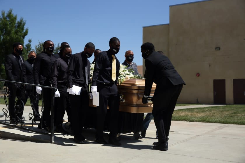 LITTLE ROCK, CA - JUNE 30: Pallbearers carry Robert Fuller's casket to the hearse in Living Stone Cathedral of Worship on Tuesday, June 30, 2020 in Little Rock, CA. According to the Los Angeles County Sheriff's Department, a passerby found Mr. Fuller's body hanging from a tree across from Palmdale City Hall on June 10. Initially, the death was ruled a suicide, but the family stated that Mr. Fuller was not suicidal. (Dania Maxwell / Los Angeles Times)