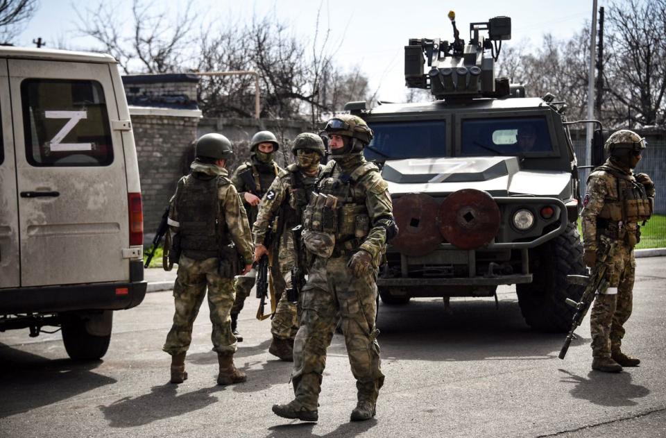 Russian soldiers patrol a street on April 11, 2022, in Volnovakha in Donetsk Oblast. The picture was taken during a trip organized by the Russian military. (Alexander Nemenov/AFP via Getty Images)