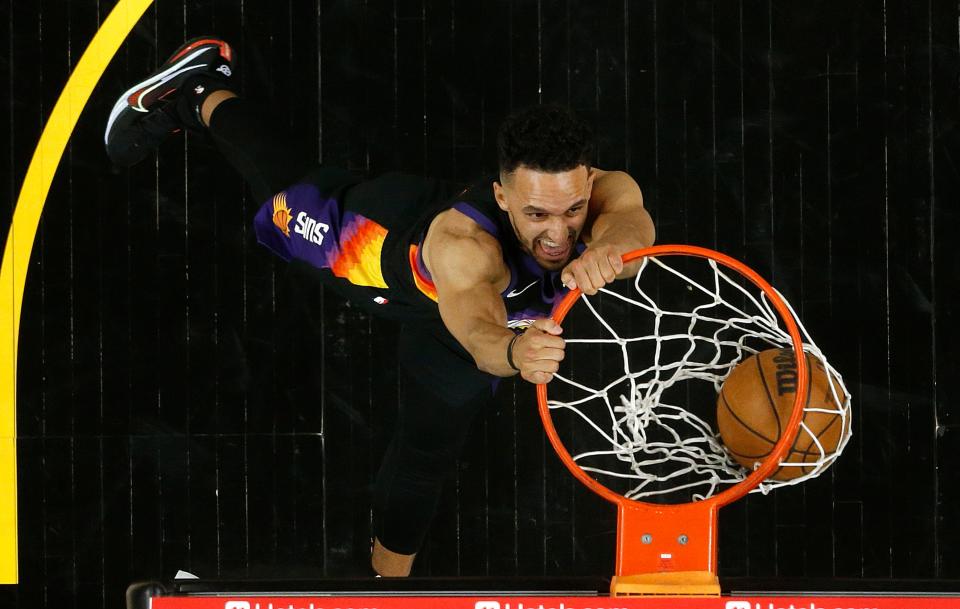 Apr 19, 2022; Phoenix, Arizona, USA; Suns' Landry Shamet (14) dunks against the Pelicans during game two of the first round of the 2022 NBA playoffs at Footprint Center.