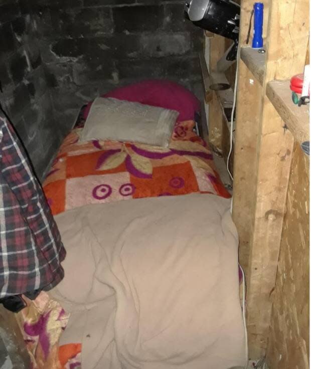 City inspectors found this "bed" in a small nook in a basement in one housing rental.