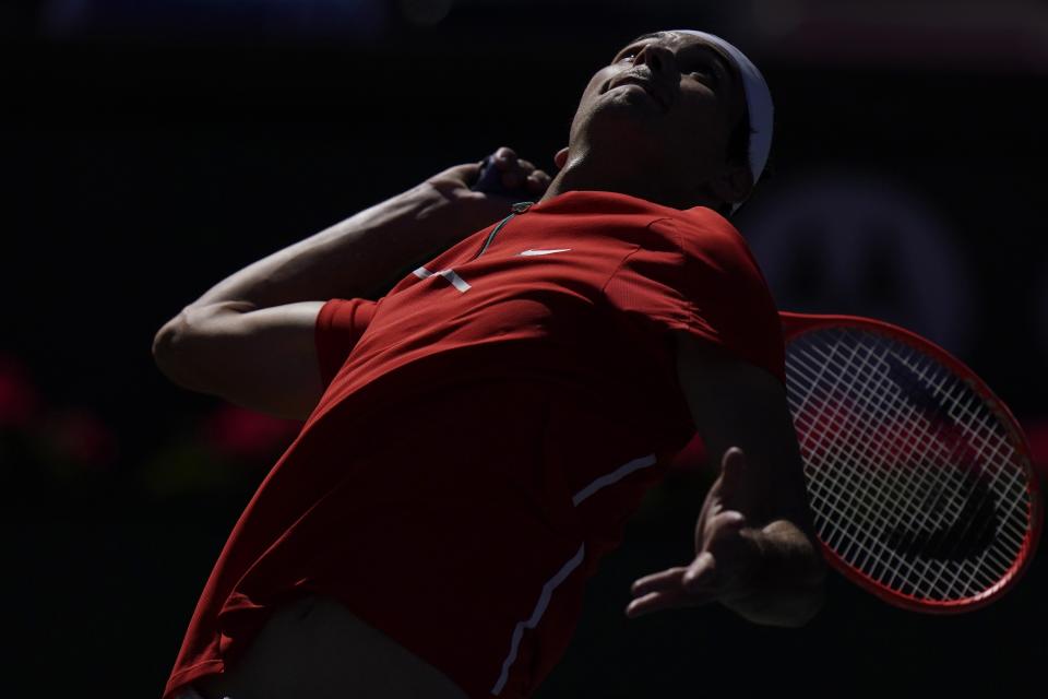 Taylor Fritz serves to Jaume Munar of Spain, at the BNP Paribas Open tennis tournament Tuesday, March 15, 2022, in Indian Wells, Calif. (AP Photo/Marcio Jose Sanchez)