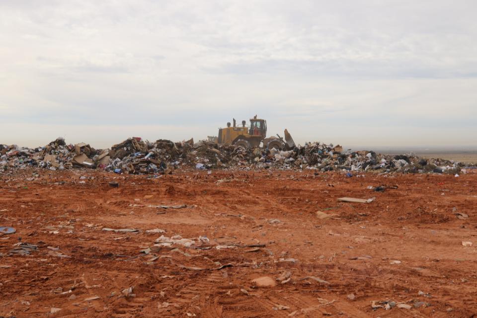 Eddy County crews work to pack trash at the Sandpoint Landfill east of Carlsbad on Oct. 18, 2021.