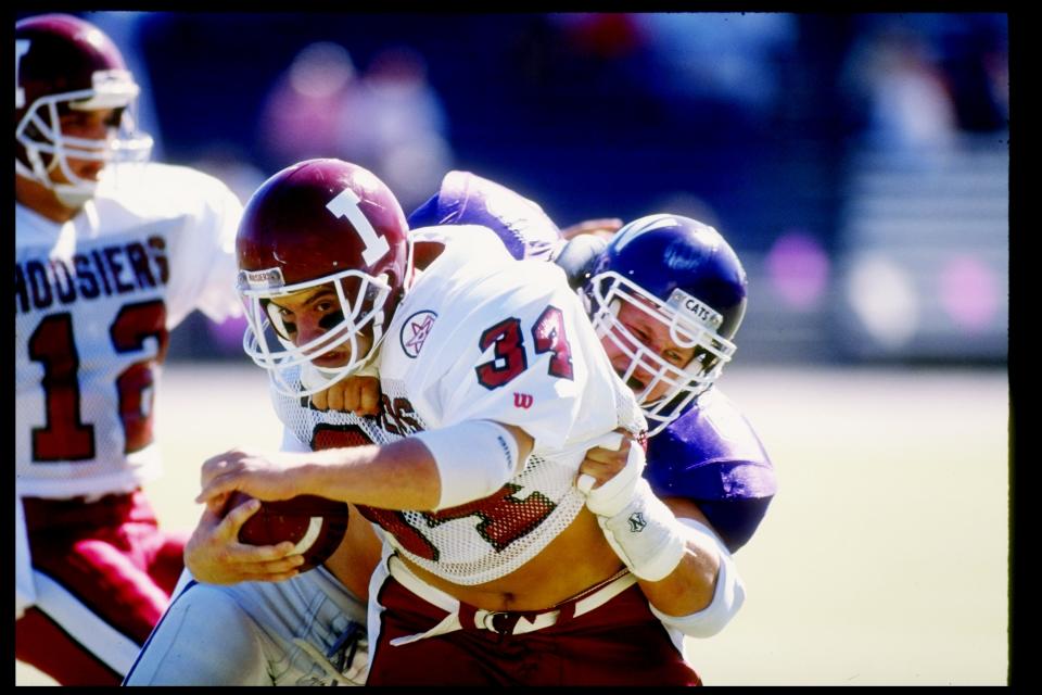 The Hoosiers and Wildcats in action during a game in 1990. (Jonathan Daniel/Stringer/Getty Images)