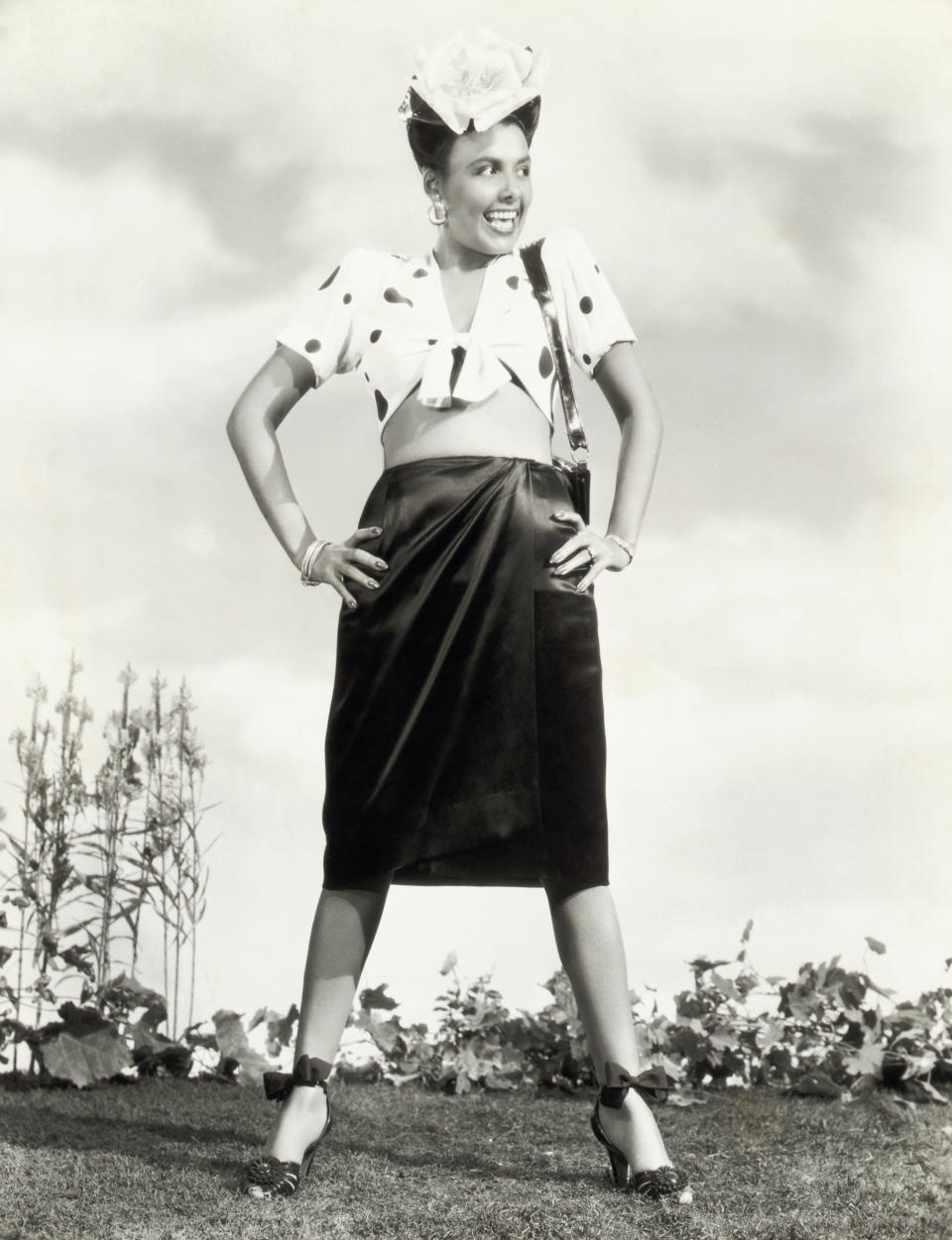 Lena Horne wears a printed top and black skirt in this photo, circa 1942.&nbsp;