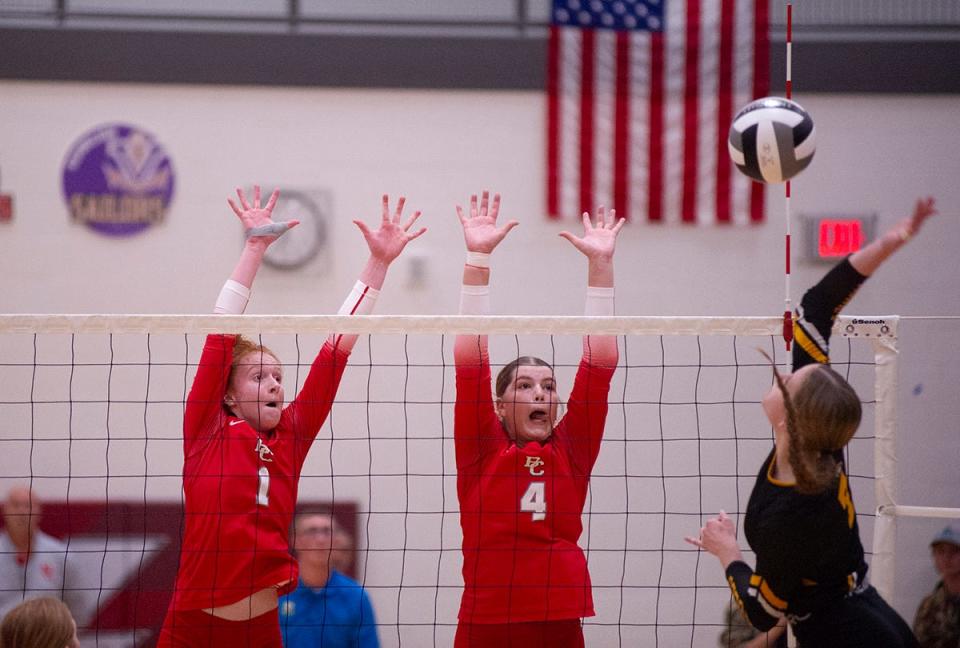 Buckeye Central's Mia McDougal and Kimmy Biglin try to block a hit from Monroeville's Ady Adams.