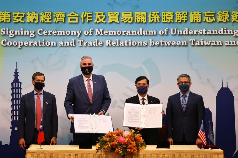 Taiwan's Deputy Economy Minister Chen Chern-chyi and Indiana Governor Eric Holcomb pose for a group photo after signing a MOU