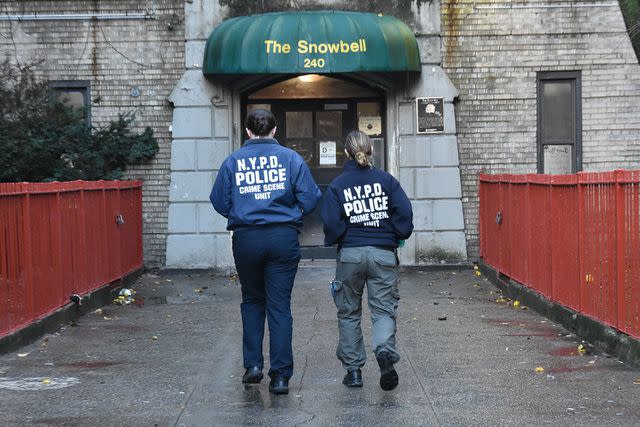 <p>Kyle Mazza/SOPA Images/Shutterstock</p> Crime scene investigators attend the family home in the Bronx.