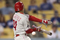 Philadelphia Phillies' Ronald Torreyes fouls off a pitch during the sixth inning of a baseball game against the Los Angeles Dodgers in Los Angeles, Monday, June 14, 2021. (AP Photo/Kyusung Gong)