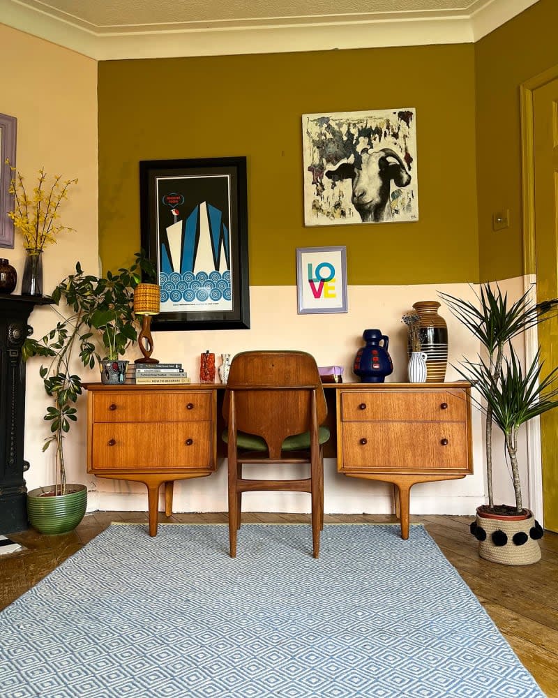 Olive and pink color block wall in home office.