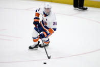 New York Islanders center Brock Nelson skates with the puck during overtime of an NHL hockey game against the Washington Capitals, Wednesday, March 29, 2023, in Washington. (AP Photo/Nick Wass)