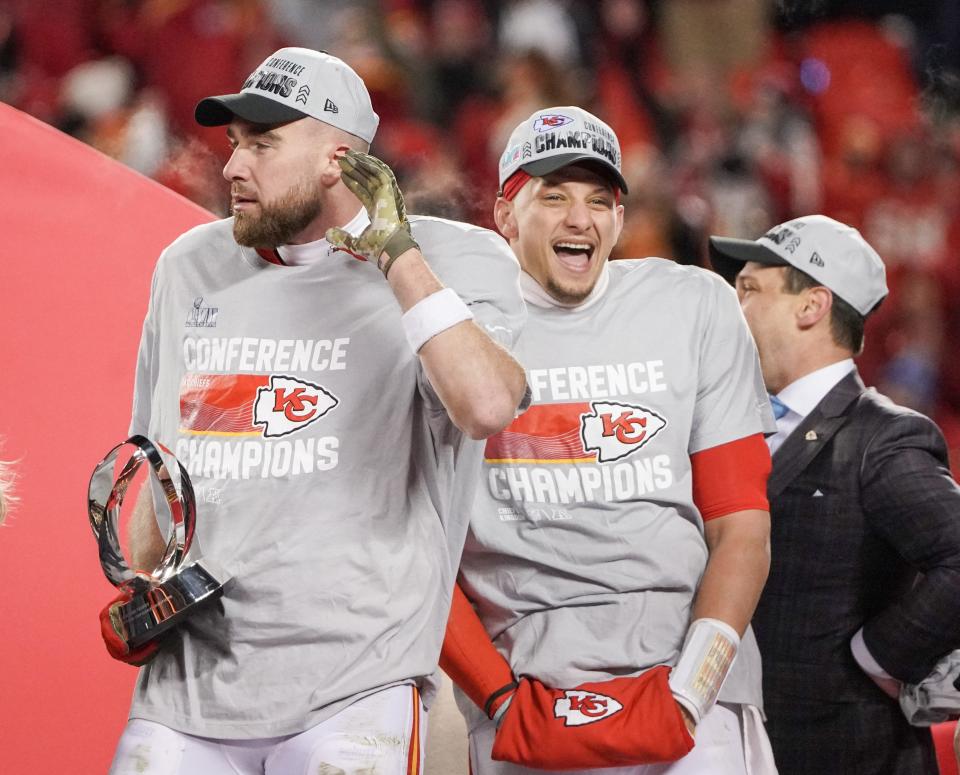 Chiefs quarterback Patrick Mahomes (15) and tight end Travis Kelce (87) celebrate after winning the AFC Championship game against the Cincinnati Bengals.