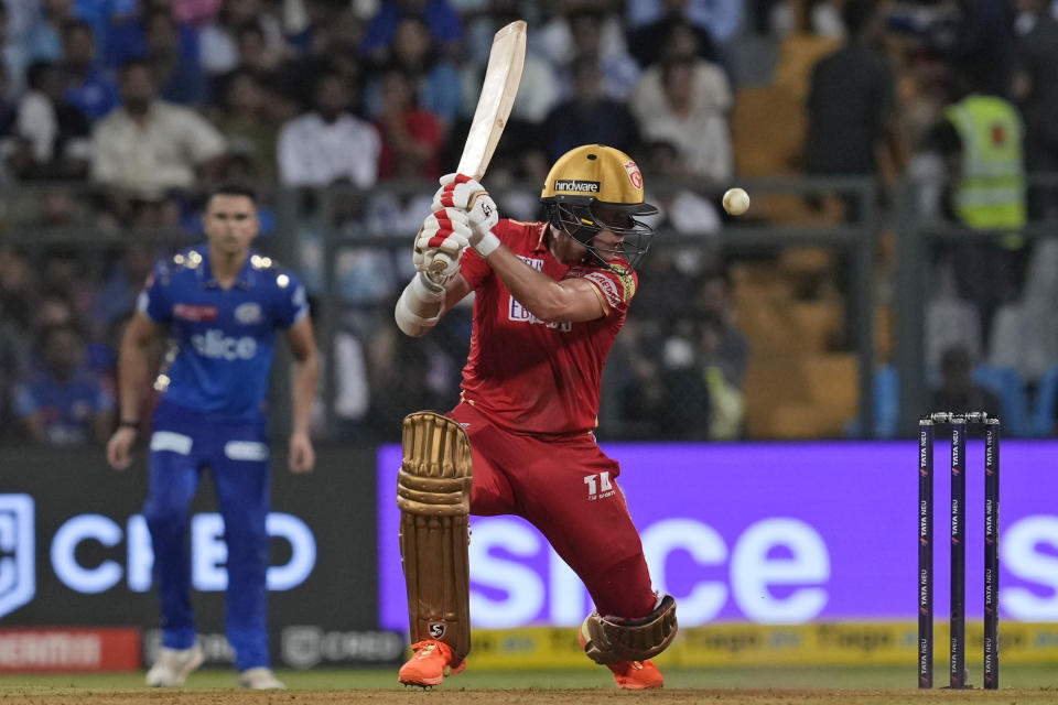 Punjab Kings' Sam Curran plays a shot during the Indian Premier League cricket match between Mumbai Indians and Punjab Kings in Mumbai, India, Saturday, April 22, 2023. (AP Photo/Rajanish Kakade)