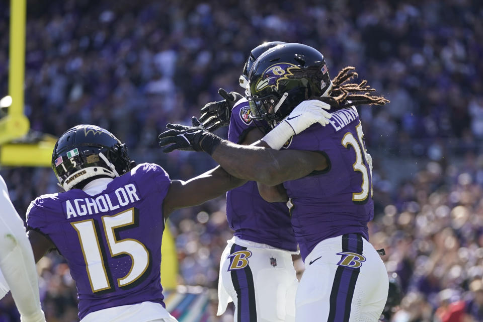 Baltimore Ravens running back Gus Edwards (35) greets teammates after a two-yard rushing touchdown during the first half of an NFL football game against the Detroit Lions, Sunday, Oct. 22, 2023, in Baltimore. (AP Photo/Alex Brandon)