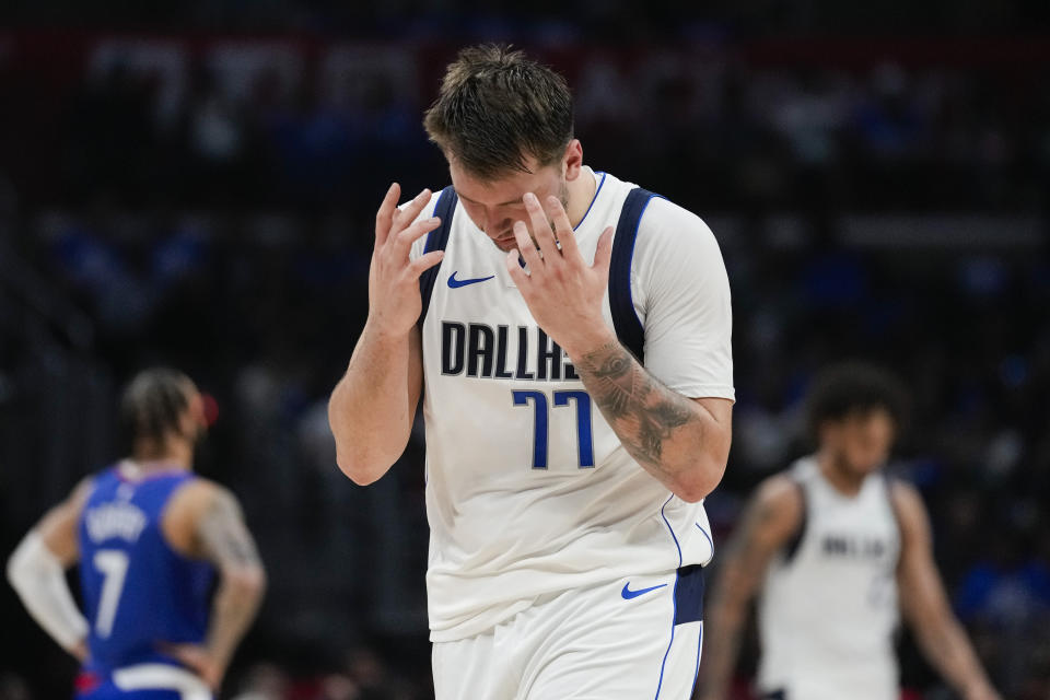Dallas Mavericks guard Luka Doncic (77) reacts after a foul call during the second half of Game 1 of an NBA basketball first-round playoff series against the LA Clippers in Los Angeles, Sunday, April 21, 2024. (AP Photo/Ashley Landis)