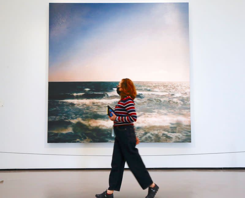 A woman walks past the painting "Seestueck" by German painter Gerhard Richter at the Kunsthaus Zurich art museum in Zurich